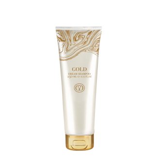 Premium Gold Dream Shampoo tube with gold marbled design; 250 ml bottle for hair care, luxury branding visible on front.