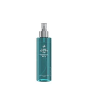 Turquoise spray bottle labeled Four Reasons Thickening Spray for hair, with silver pump nozzle.
