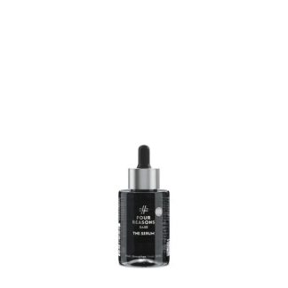 Dark glass serum bottle with dropper cap on a white background, labeled 'Four Reasons Base: The Serum'