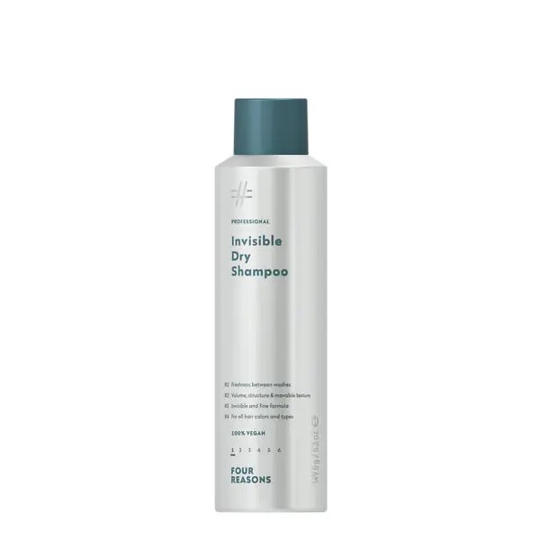 Tall white bottle with teal cap labeled Invisible Dry Shampoo by Four Reasons