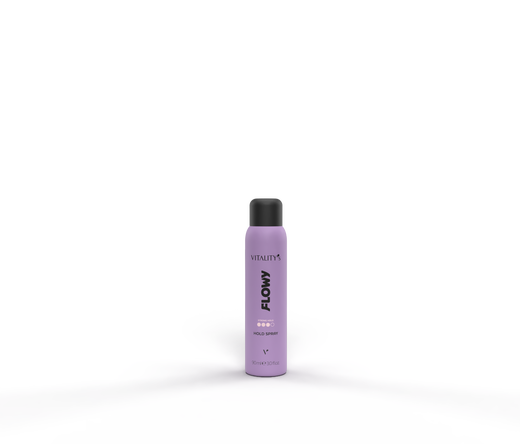 Lavender spray bottle labeled FLOW standing on a purple-lit surface against a dark background.
