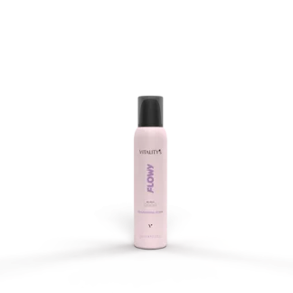 Pink bottle labeled Vitality's Flow Nourishing Foam standing upright on a textured surface with a dark background.