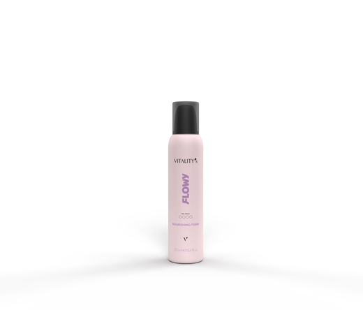 Pink bottle labeled Vitality's Flow Nourishing Foam standing upright on a textured surface with a dark background.
