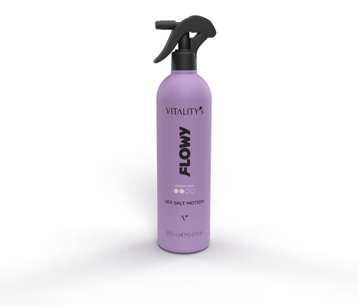 Purple spray bottle labeled FLOW from Vitality's Sea Salt Motion, with a black trigger sprayer, centered over lavender mist.
