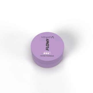 Purple circular jar of Vitality's Flow Shine Pomade viewed from above, resting on a dark surface with hair framing the scene.
