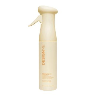 Cream-colored spray bottle with a pump top; vertical label reads DESIGNME.