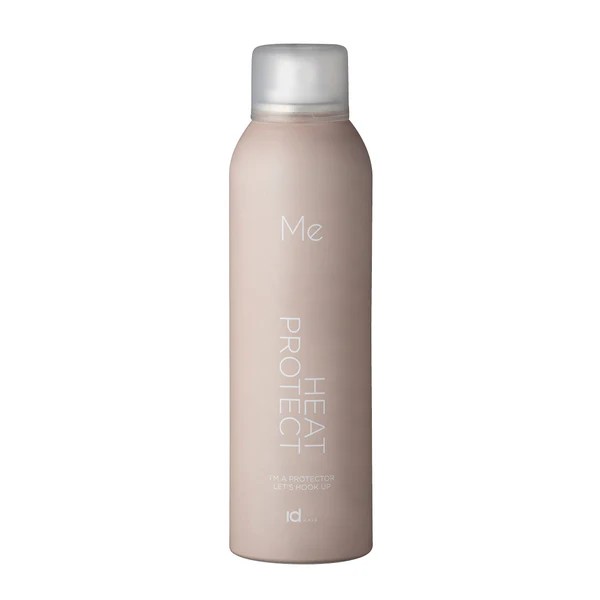 Beige hair heat-protection spray bottle with a silver cap and white text reading 'Me Heat Protect'