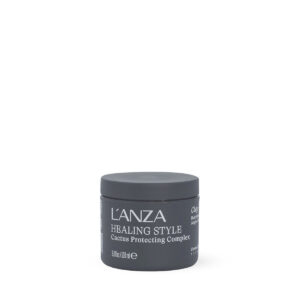 Small dark gray cosmetic jar with a lid, labeled ‘L’ANZA Healing Style Color Protecting Complex’ (travel size).