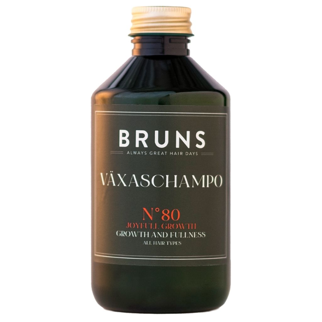 Bottle of BRUNS Växaschampo No. 80 with gold cap; text reads 'Growth and Fullness' for all hair types (hair growth shampoo).